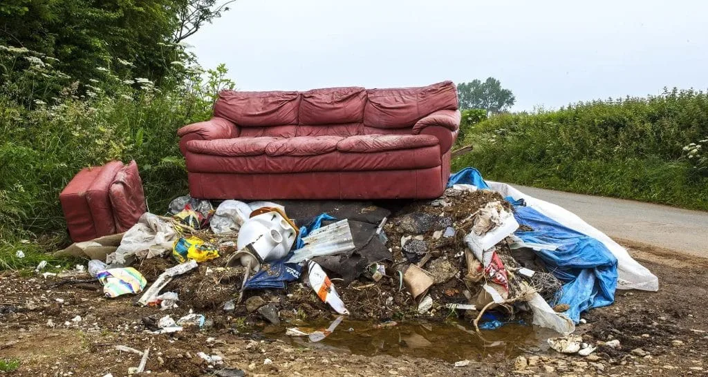 image of rubbish by a road fly tipping