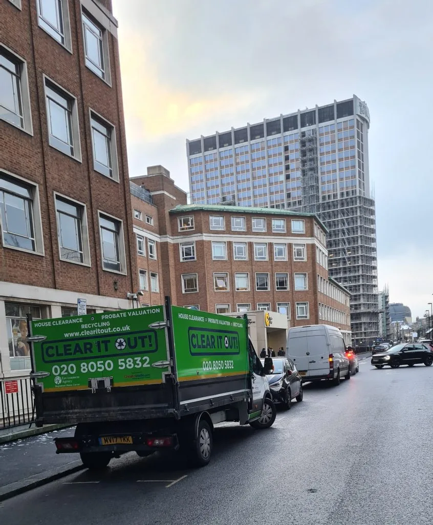 A clear-out van on a street outside of flats in Croydon, performing a house clearance.