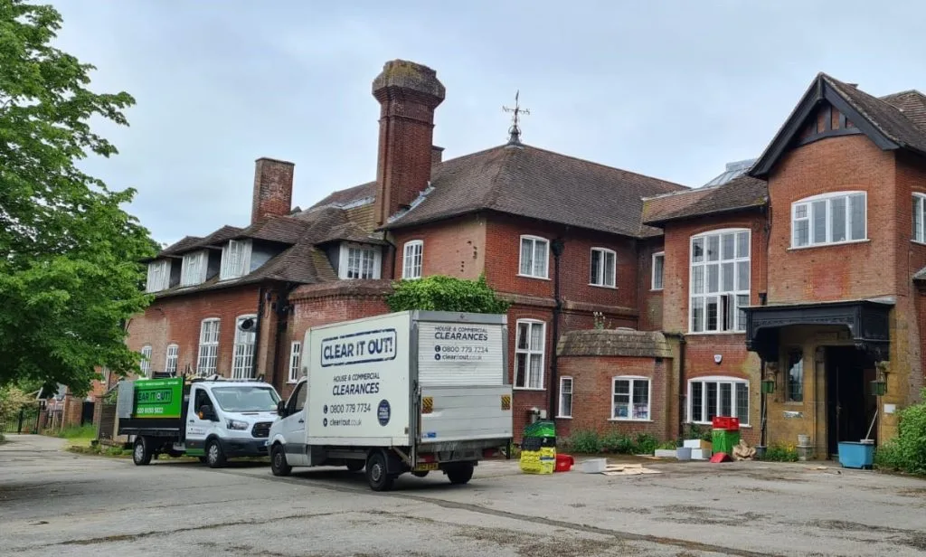 Two clear out bins outside a house in Croydon having a house clearance service.