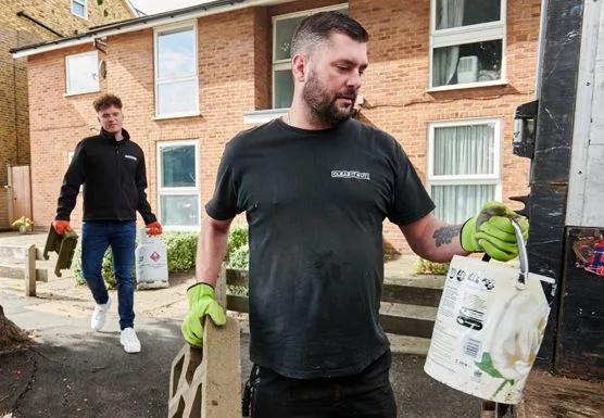 Two men performing a house clearance service in Croydon.