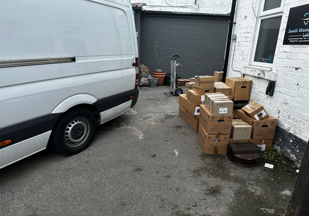 boxes next to a van being removed using a clearance service
