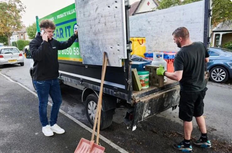 House clearing experts loading a van