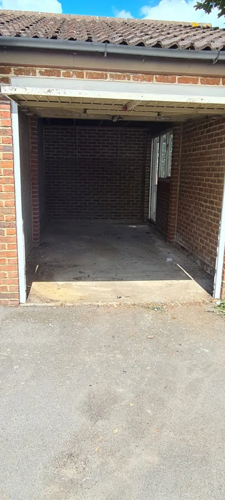 A clean and empty garage after a clearance service was provided